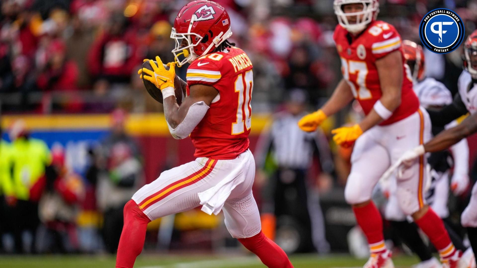 Kansas City Chiefs running back Isiah Pacheco (10) catches a touchdown pass in the first quarter of the NFL Week 17 game between the Kansas City Chiefs and the Cincinnati Bengals at Arrowhead Stadium in Kansas City, Mo., on Sunday, Dec. 31, 2023.