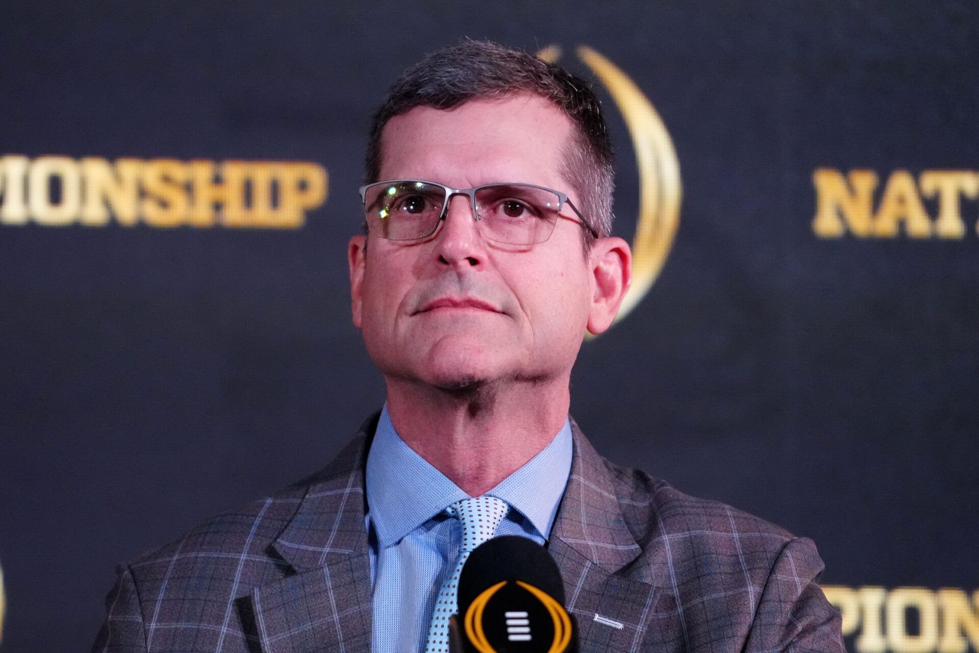 Michigan Wolverines head coach Jim Harbaugh at the press conference of the NCAA National Championship.