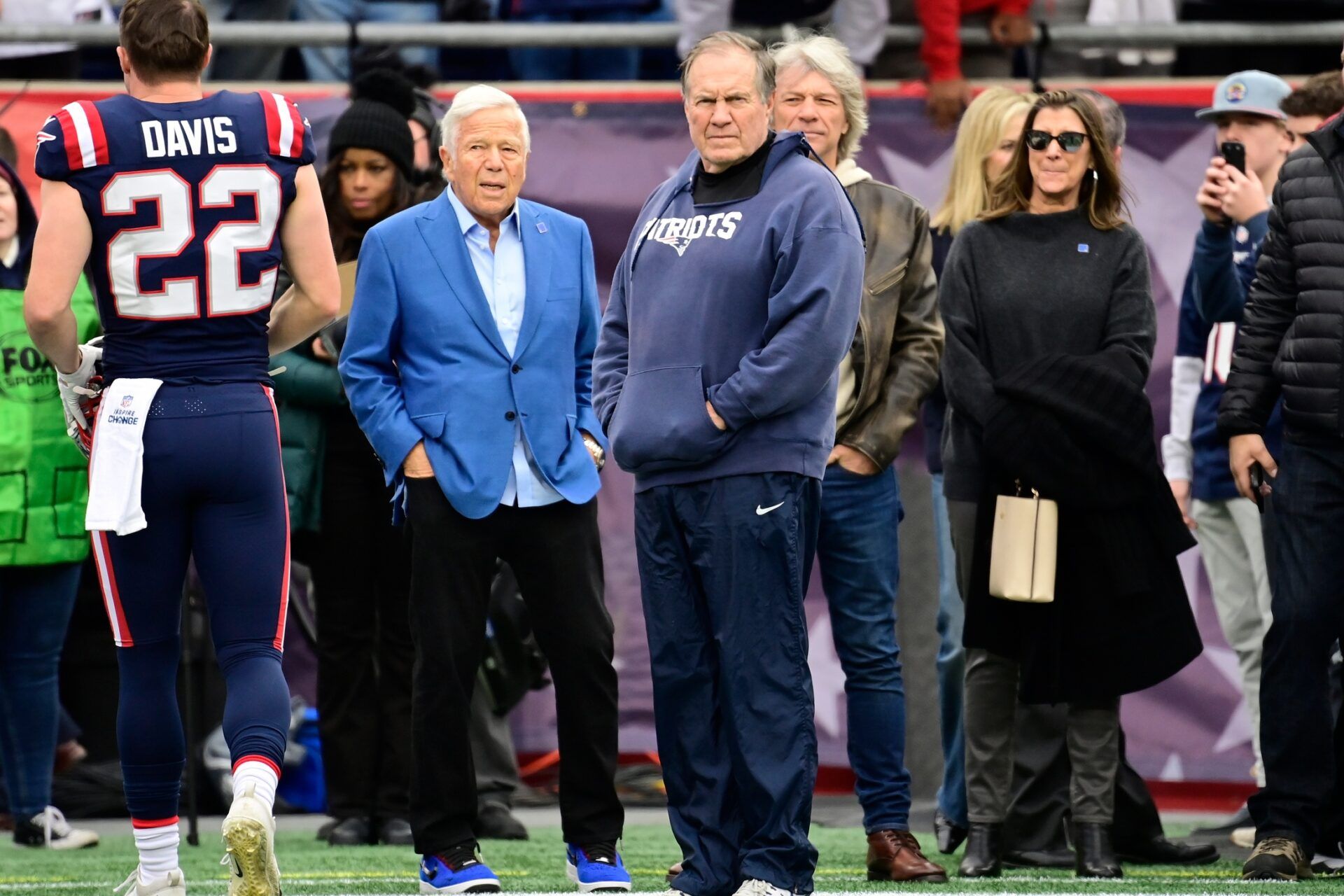 New England Patriots owner Robert Kraft (left) and head coach Bill Belichick (right) look on during warmups before the team's game against the Kansas City Chiefs.