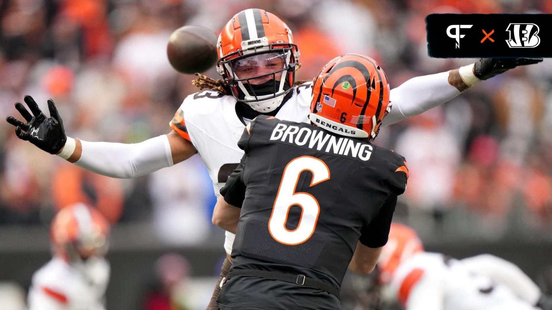 Cincinnati Bengals quarterback Jake Browning (6) throws around pressure from Cleveland Browns safety Ronnie Hickman (33) in the second quarter during a Week 18 NFL football game between the Cleveland Browns at Cincinnati Bengals, Sunday, Jan. 7, 2024, at Paycor Stadium in Cincinnati.