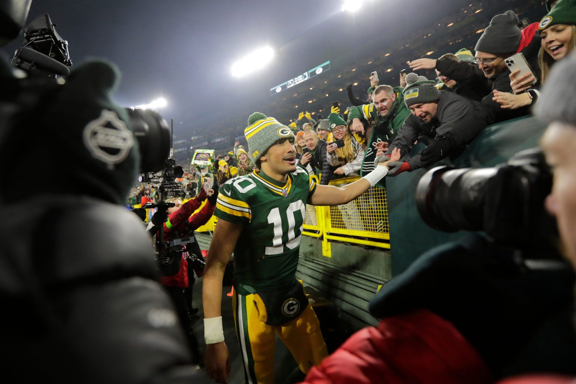 Green Bay Packers quarterback Jordan Love (10) celebrates with fans after defeating the Chicago Bears during their football game Sunday, January 7, 2024, in Green Bay, Wisconsin.