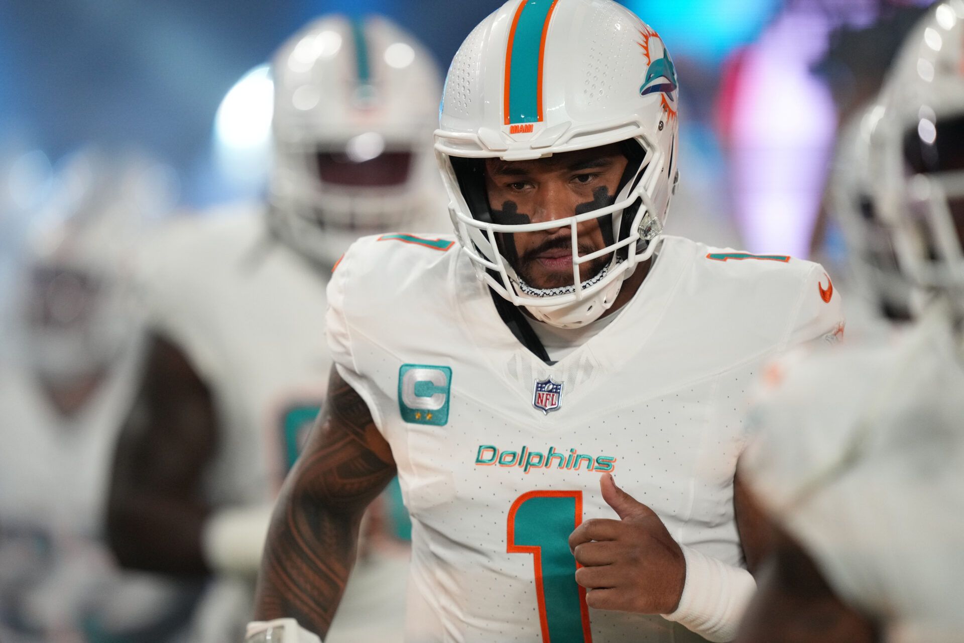 Jan 7, 2024; Miami Gardens, Florida, USA; Miami Dolphins quarterback Tua Tagovailoa (1) prepares to take the field for warm-up before the game against the Buffalo Bills at Hard Rock Stadium. Mandatory Credit: Jim Rassol-USA TODAY Sports