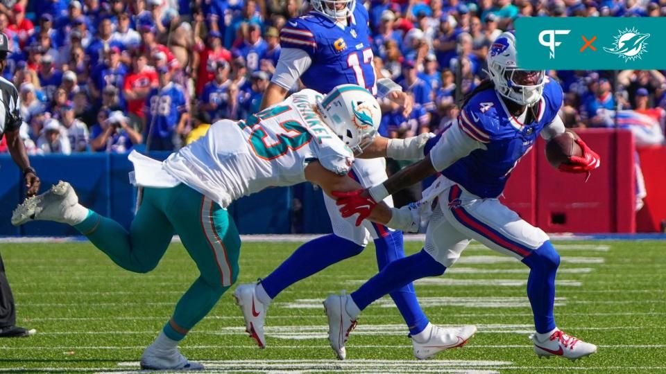 Buffalo Bills running back James Cook (4) runs with the ball against Miami Dolphins linebacker Andrew Van Ginkel (43) during the second half at Highmark Stadium.