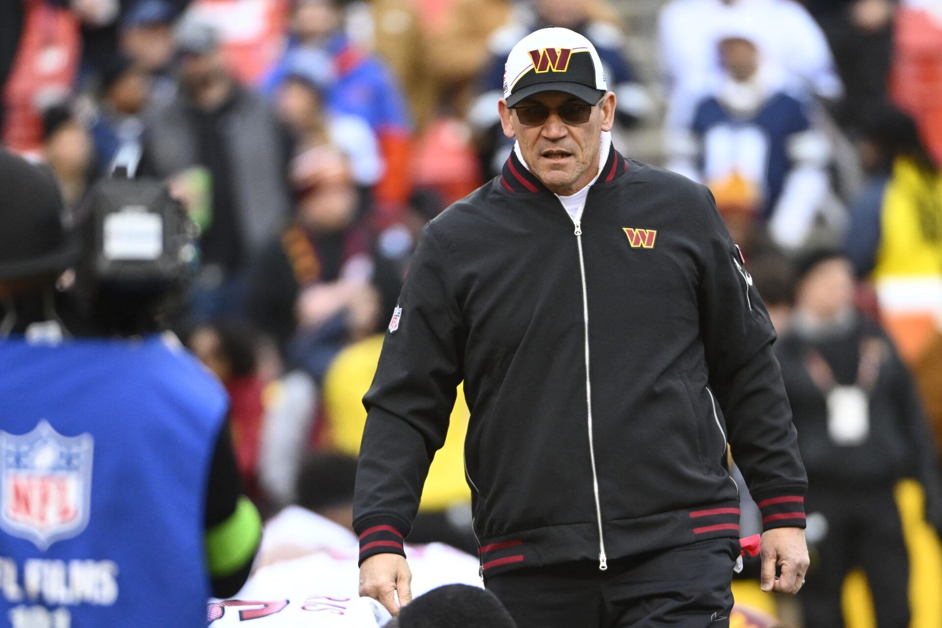 Washington Commanders head coach Ron Rivera walks onto the field before the game against the Dallas Cowboys.