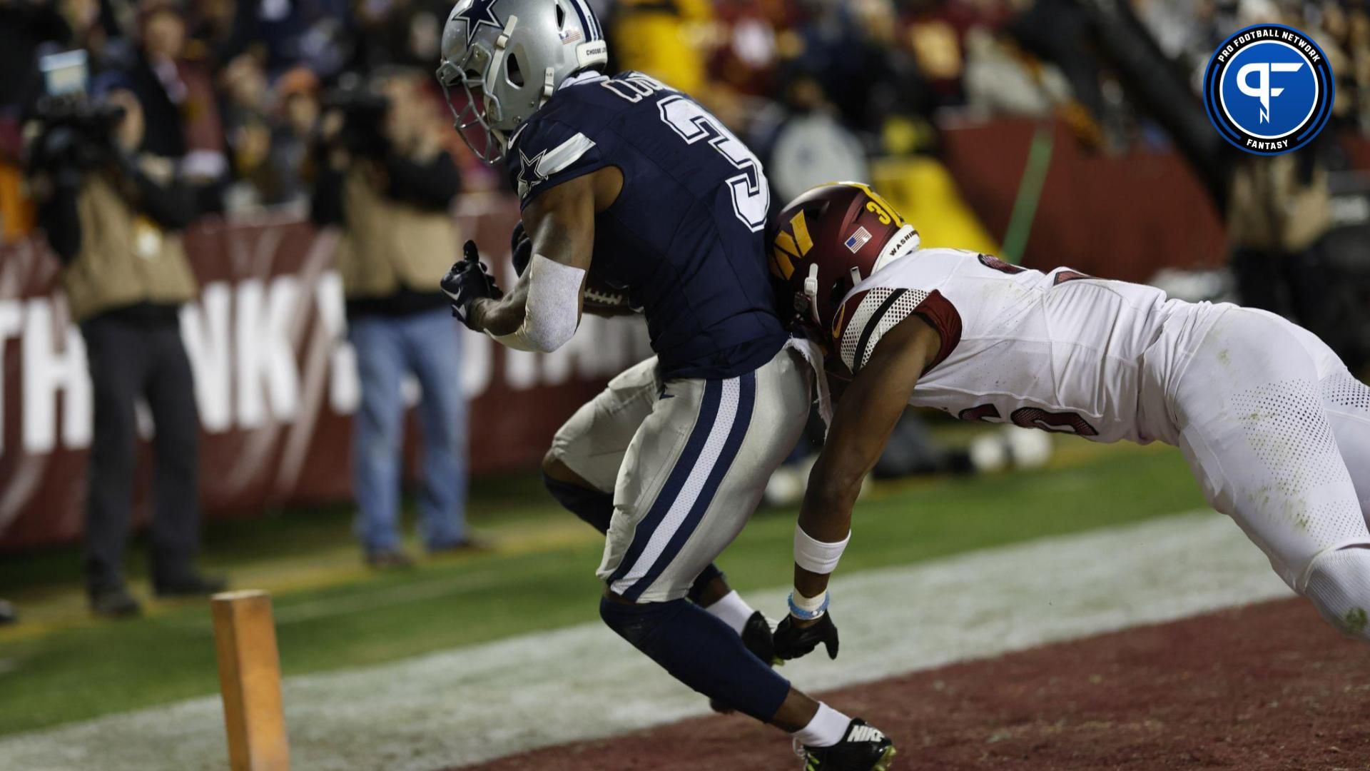 Dallas Cowboys WR Brandin Cooks (3) scores a touchdown against the Washington Commanders.