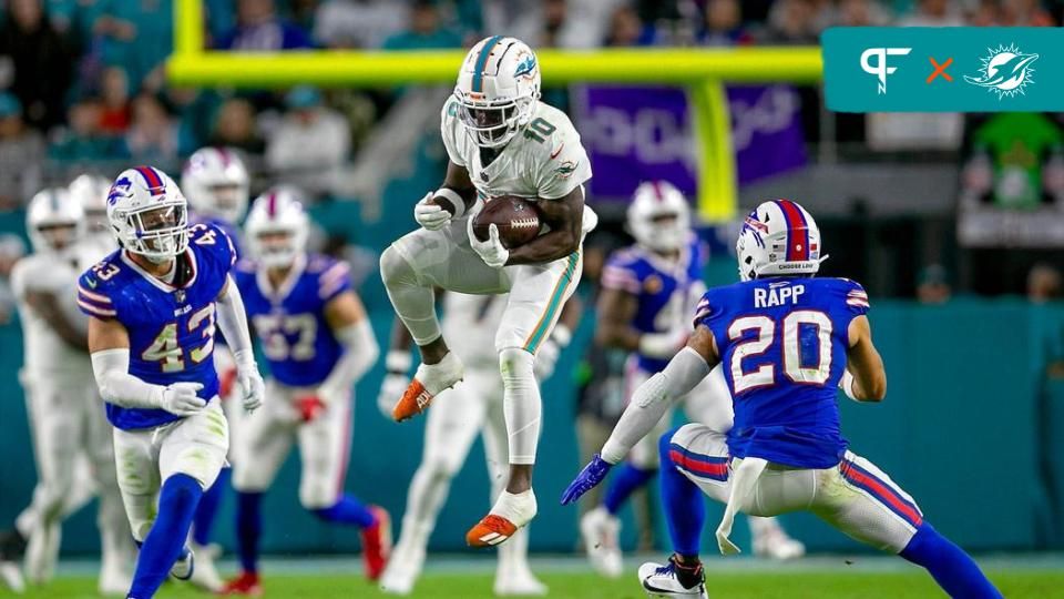 Tyreek Hill (10), leaps to make a catch for a first down in front of Buffalo Bills safety Taylor Rapp (20), during second half action.