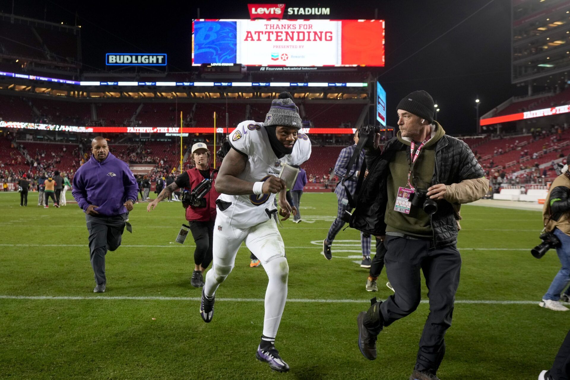 Baltimore Ravens quarterback Lamar Jackson (8) runs towards the locker room after the Ravens defeated the San Francisco 49ers at Levi's Stadium.