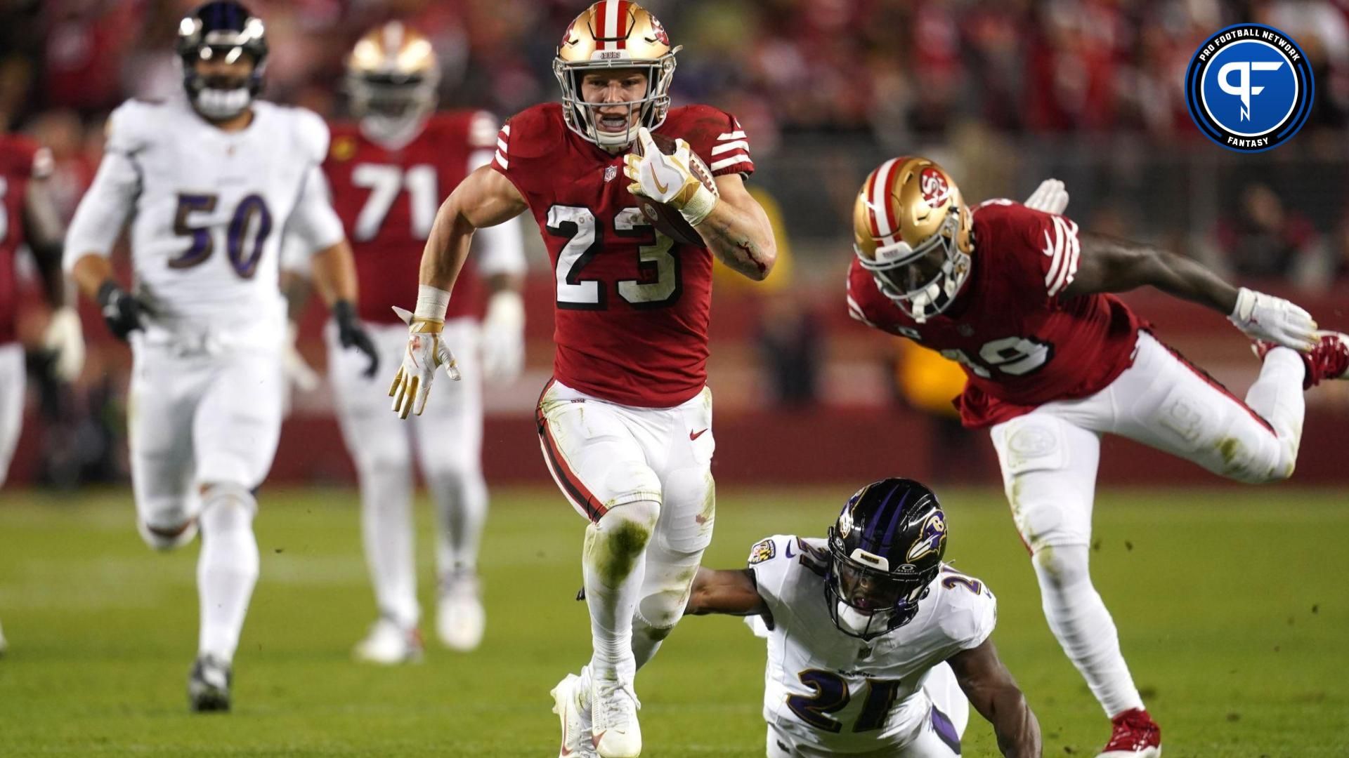 San Francisco 49ers running back Christian McCaffrey (23) runs the ball pressured by Baltimore Ravens cornerback Brandon Stephens (21) in the second quarter at Levi's Stadium.