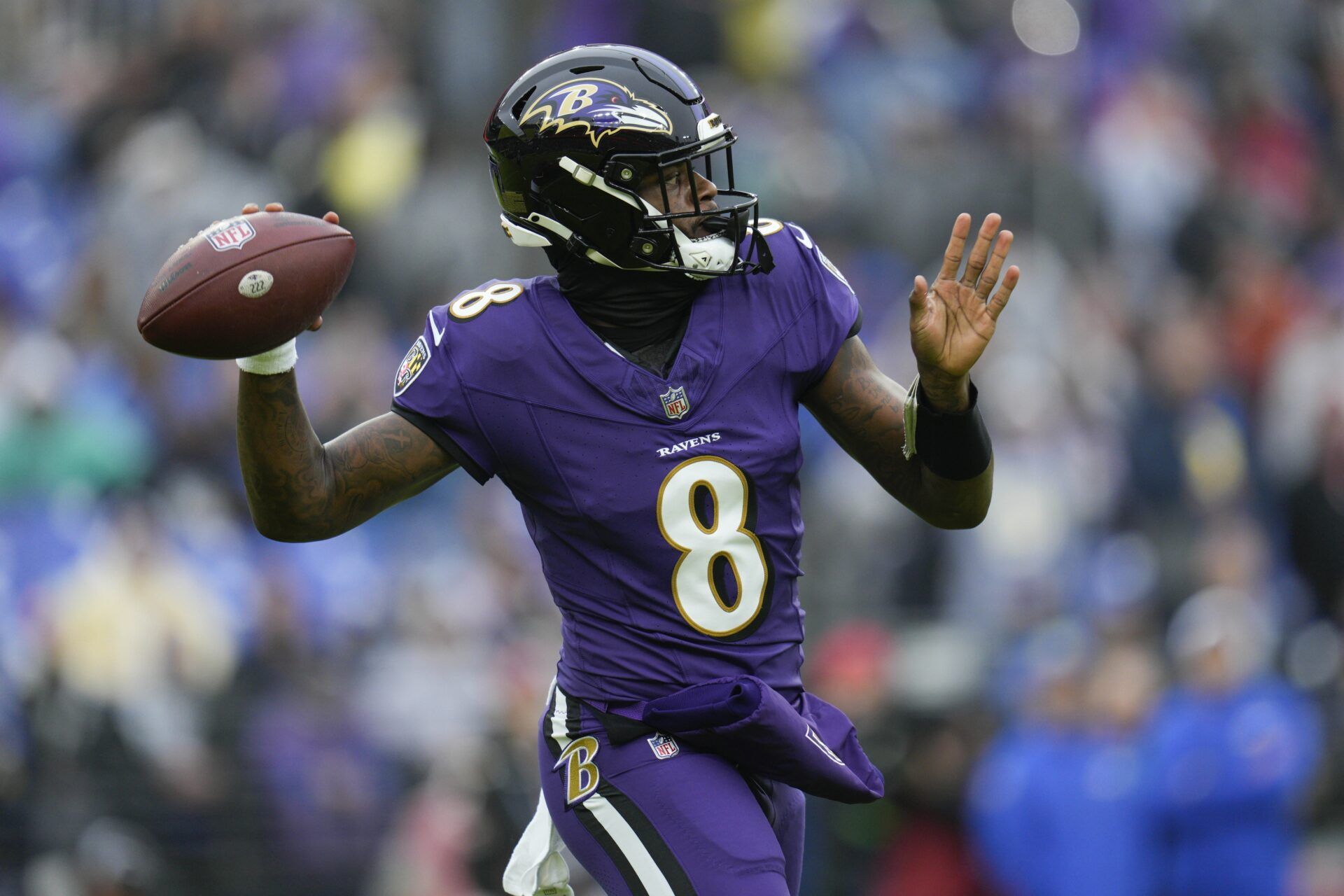 Baltimore Ravens quarterback Lamar Jackson (8) passes during the first quarter against the Los Angeles Rams at M&T Bank Stadium.