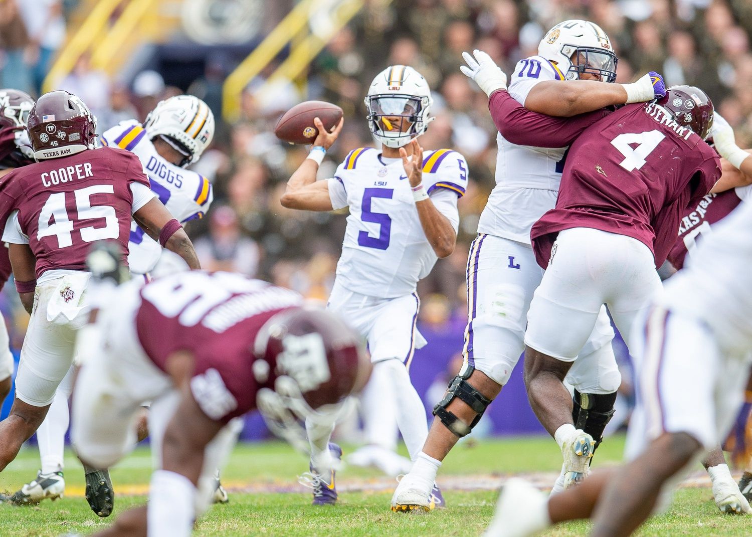 LSU quarterback Jayden Daniels looks to throw during his team's game against Texas A&M in Tiger Stadium in Baton Rouge, Louisiana, November 25, 2023.