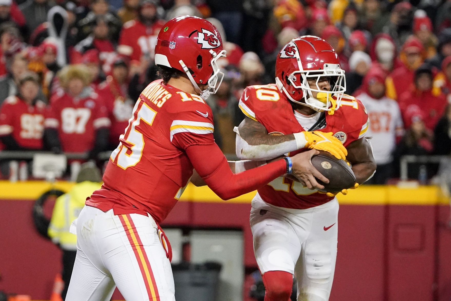 Kansas City Chiefs quarterback Patrick Mahomes (15) hands off to running back Isiah Pacheco (10) against the Cincinnati Bengals during the second half at GEHA Field at Arrowhead Stadium.