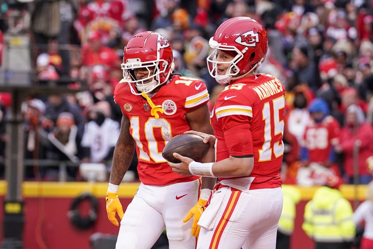 Kansas City Chiefs quarterback Patrick Mahomes (15) celebrates with running back Isiah Pacheco (10) after Pacheco’s touchdown catch against the Cincinnati Bengals during the first half at GEHA Field at Arrowhead Stadium.