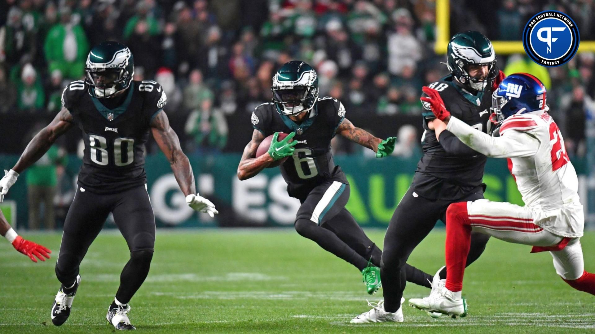 Philadelphia Eagles wide receiver DeVonta Smith (6) follows block by wide receiver Julio Jones (80) and tight end Dallas Goedert (88) against the New York Giants during the fourth quarter at Lincoln Financial Field.