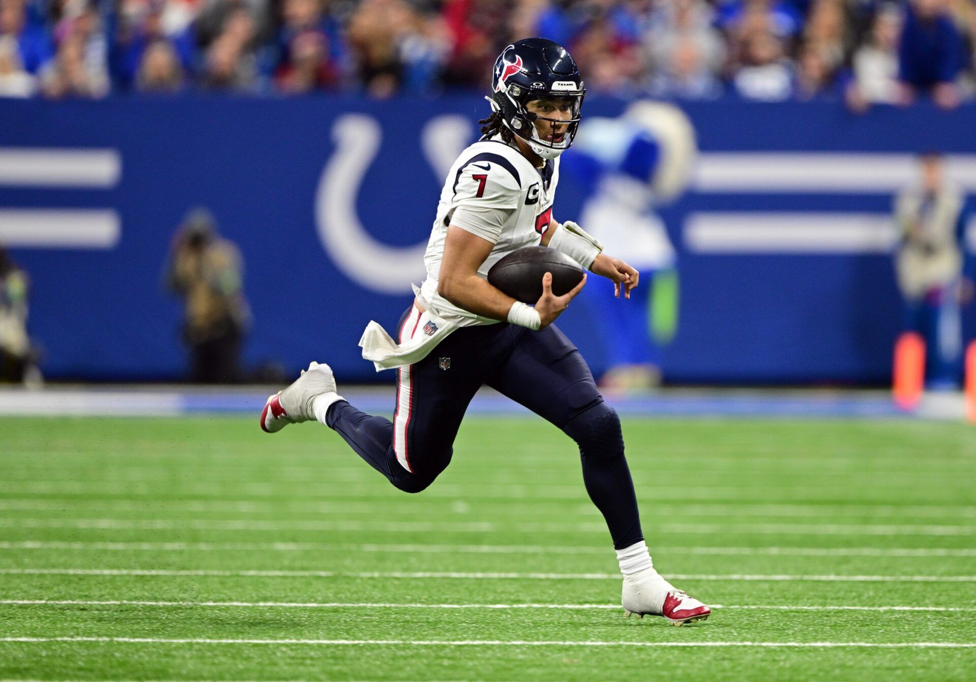 Houston Texans quarterback C.J. Stroud (7) runs the ball against the Indianapolis Colts during the second half at Lucas Oil Stadium.