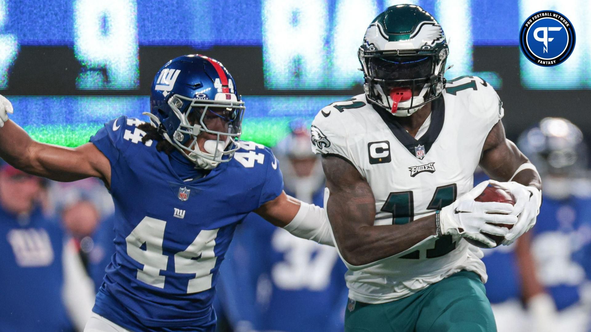 Philadelphia Eagles wide receiver A.J. Brown (11) catches the ball as New York Giants cornerback Nick McCloud (44) pursues during the first quarter at MetLife Stadium.