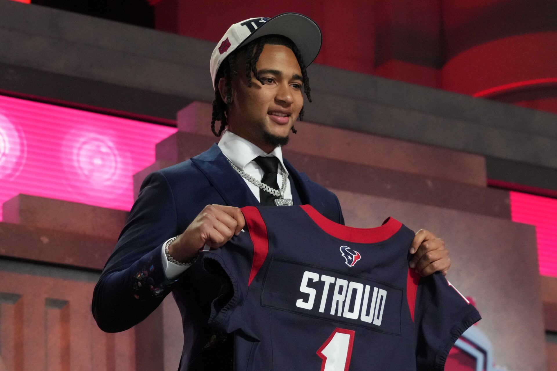 Ohio State Buckeyes quarterback CJ Stroud (left) poses with jersey after being selected as the No. 2 pick in the first round of the 2023 NFL Draft at Union Station.