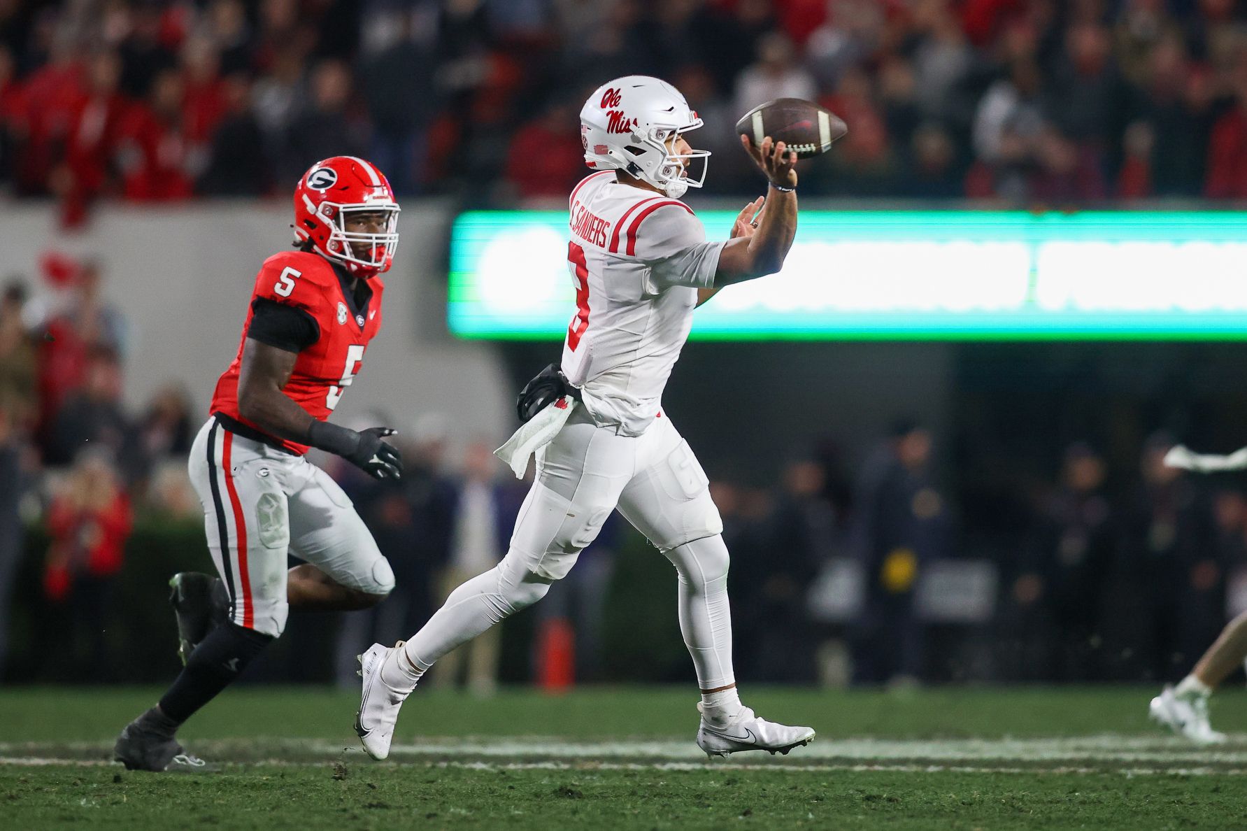 Mississippi Rebels quarterback Spencer Sanders (3) throws a pass against the Georgia Bulldogs in the fourth quarter at Sanford Stadium.