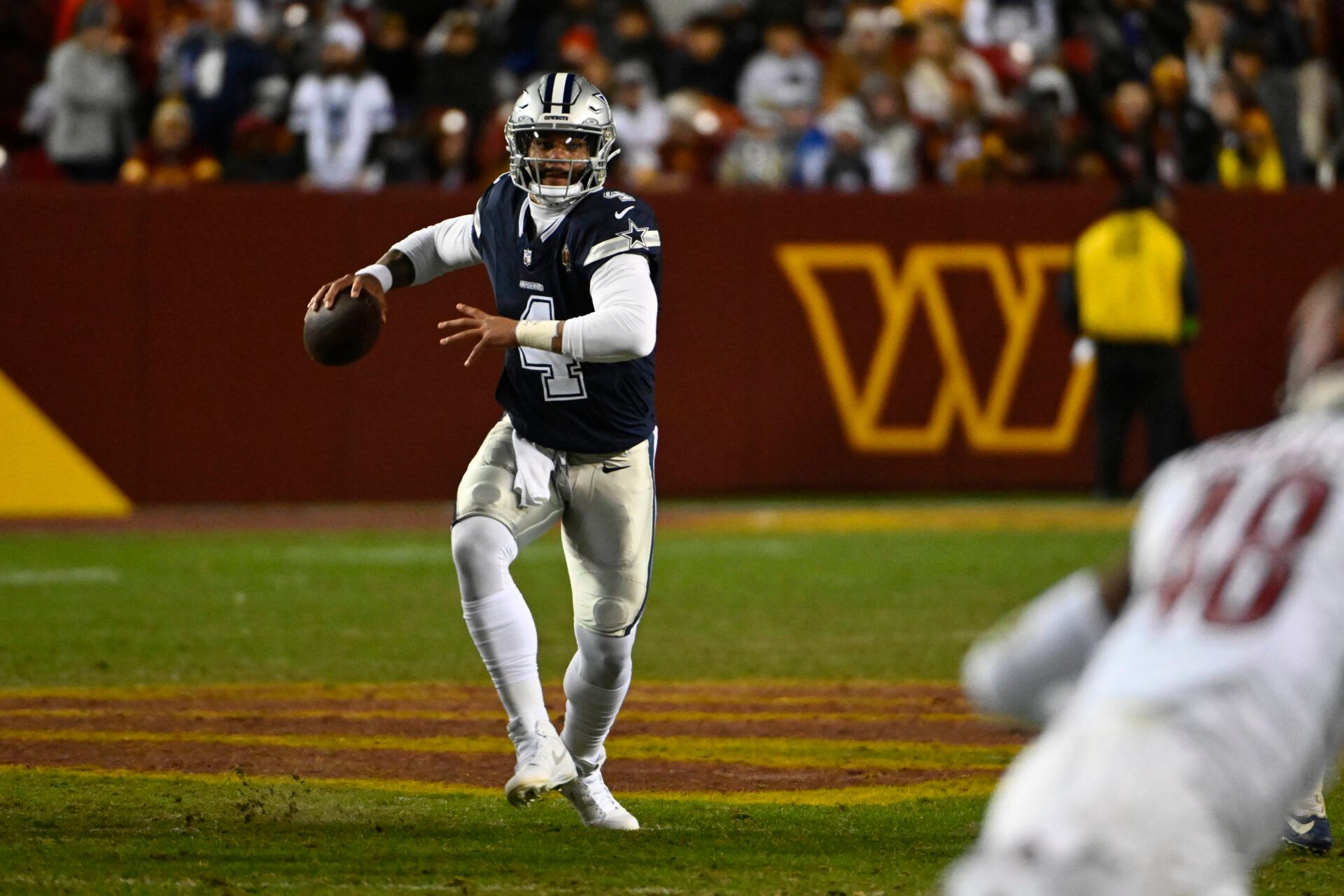 Dallas Cowboys quarterback Dak Prescott (4) looks to pass against the Washington Commanders during the second half at FedExField.