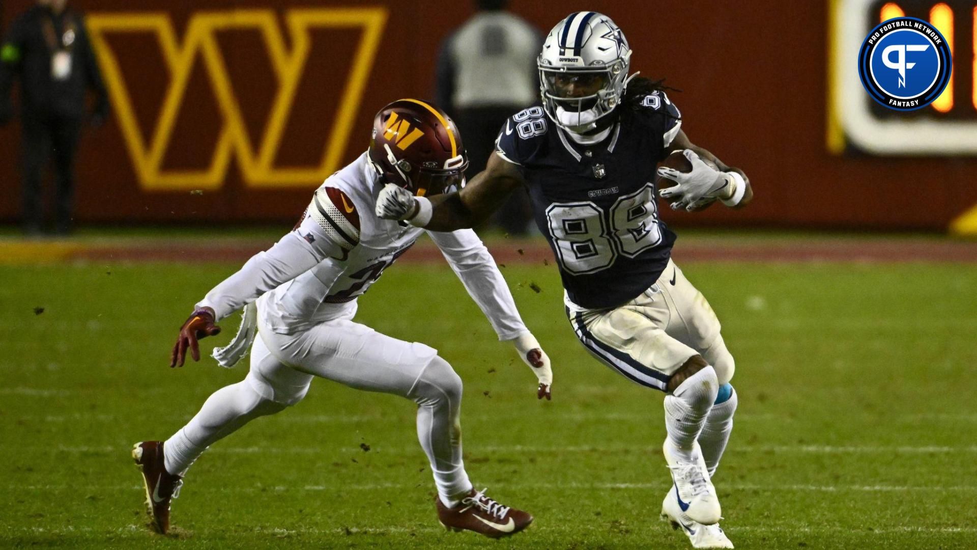 Dallas Cowboys wide receiver CeeDee Lamb (88) runs past Washington Commanders cornerback Tariq Castro-Fields (26) during the second half at FedExField.