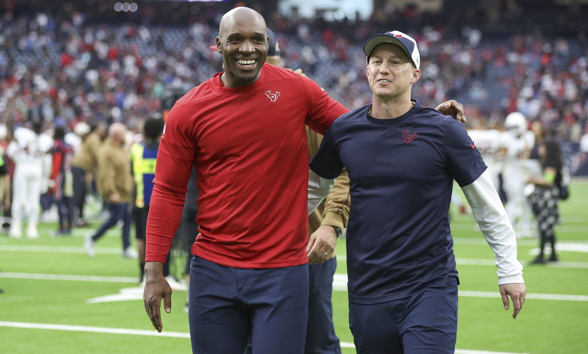 Houston Texans head coach DeMeco Ryans (left) and offensive coordinator Bobby Slowik walk off the field after the game against the Arizona Cardinals at NRG Stadium.