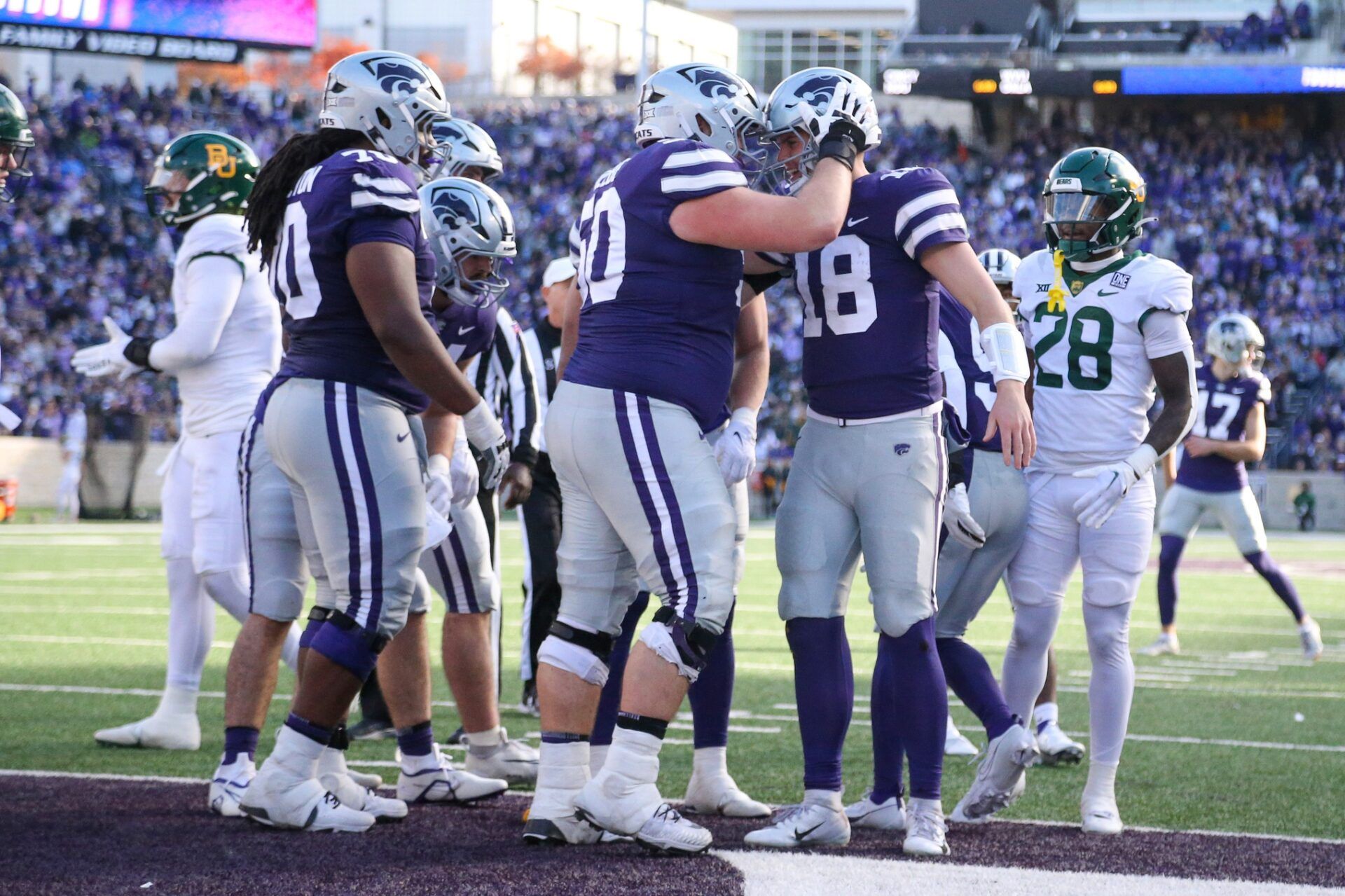 Kansas State Wildcats quarterback Will Howard (18) is congratulated by offensive lineman Cooper Beebe (50) after scoring a touchdown in the second quarter against the Baylor Bears at Bill Snyder Family Football Stadium.