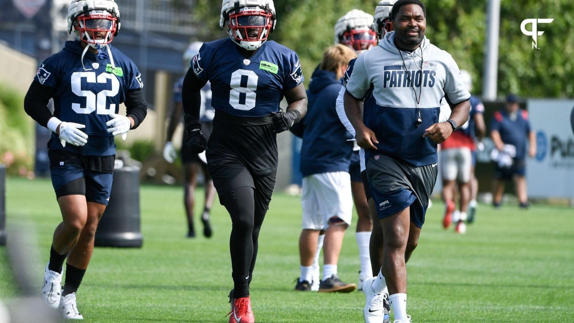 New England Patriots defensive back Marcus Jones (52), linebacker Ja'Whaun Bentley (8) and linebackers coach Jerod Mayo Sr. (L to R) workout at the Patriots training camp at Gillette Stadium.