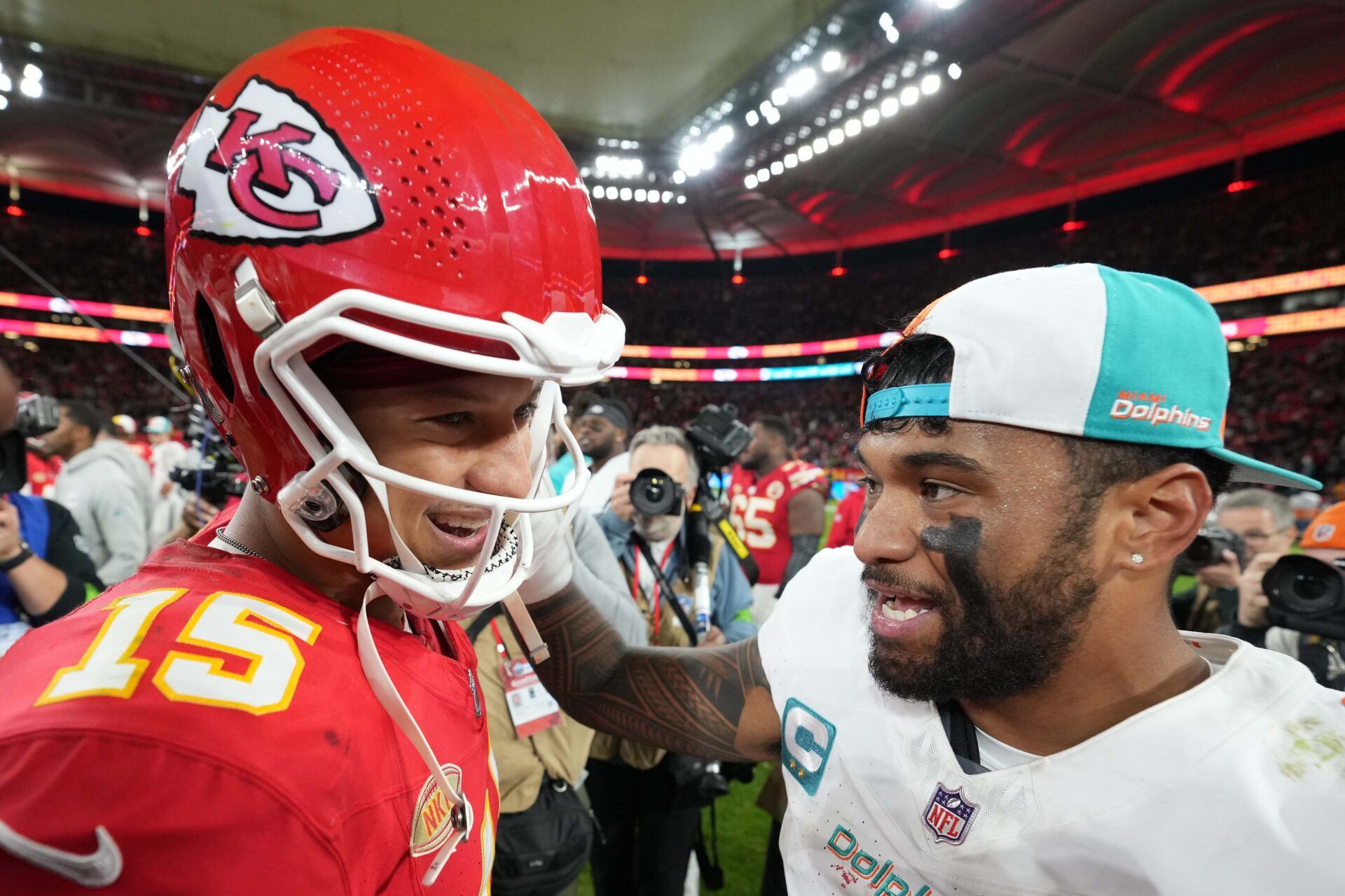 Kansas City Chiefs quarterback Patrick Mahomes (15) and Miami Dolphins quarterback Tua Tagovailoa (1) shake hands after an NFL International Series game at Deutsche Bank Park.