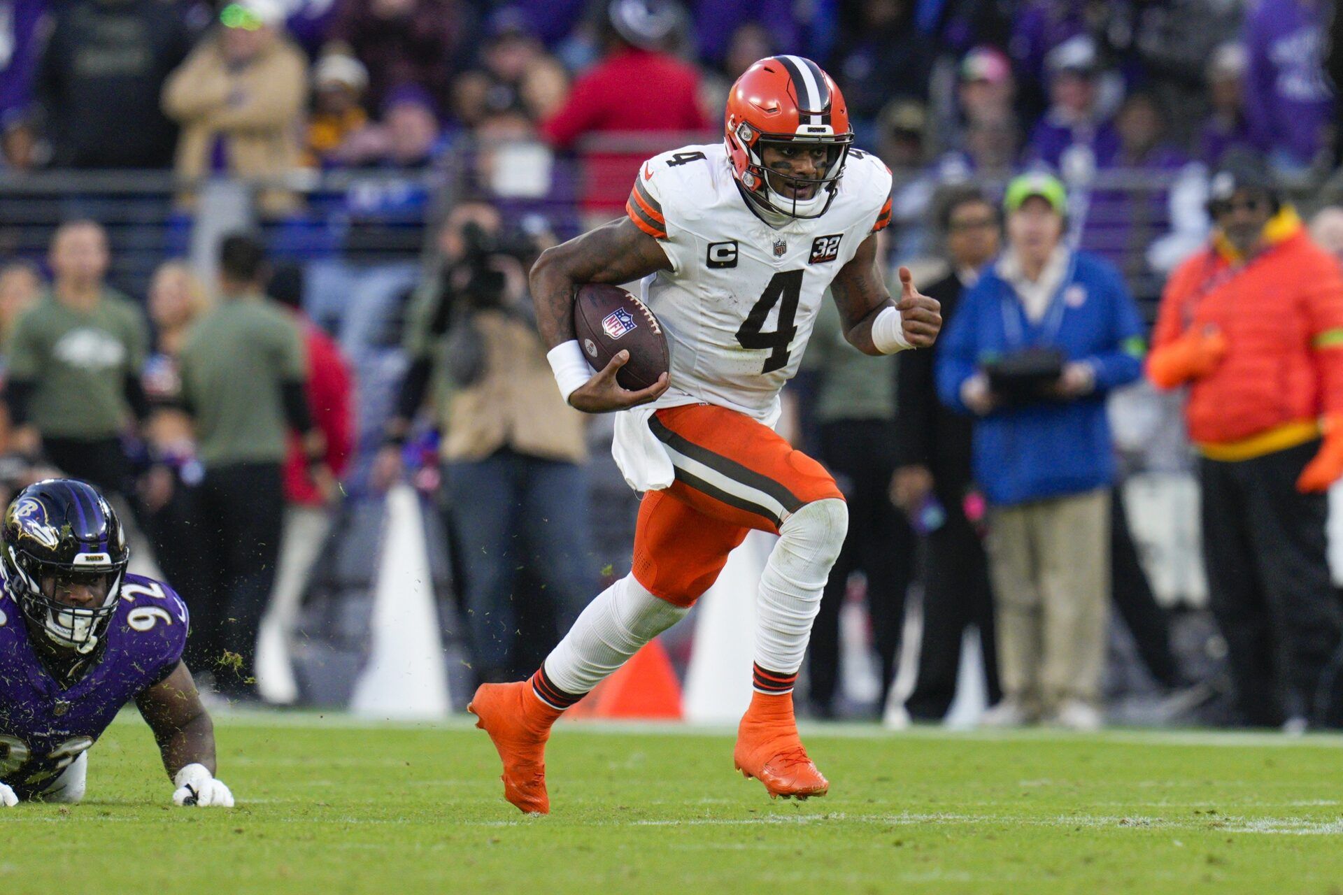 Cleveland Browns quarterback Deshaun Watson (4) runs with the ball during the second half against the Baltimore Ravens at M&T Bank Stadium.