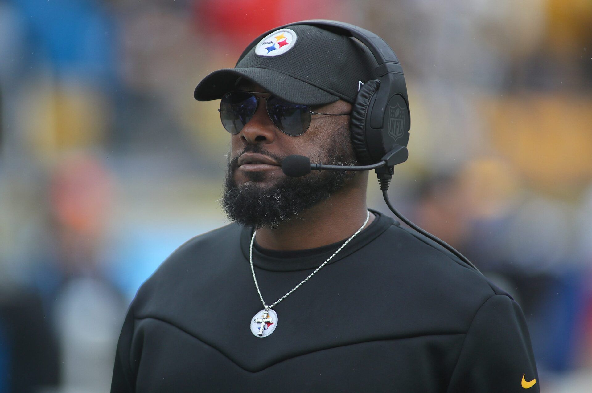 Pittsburgh Steelers head coach Mike Tomlin roams the sidelines during player introductions prior to the start of the game against the Jacksonville Jaguars at Acrisure Stadium