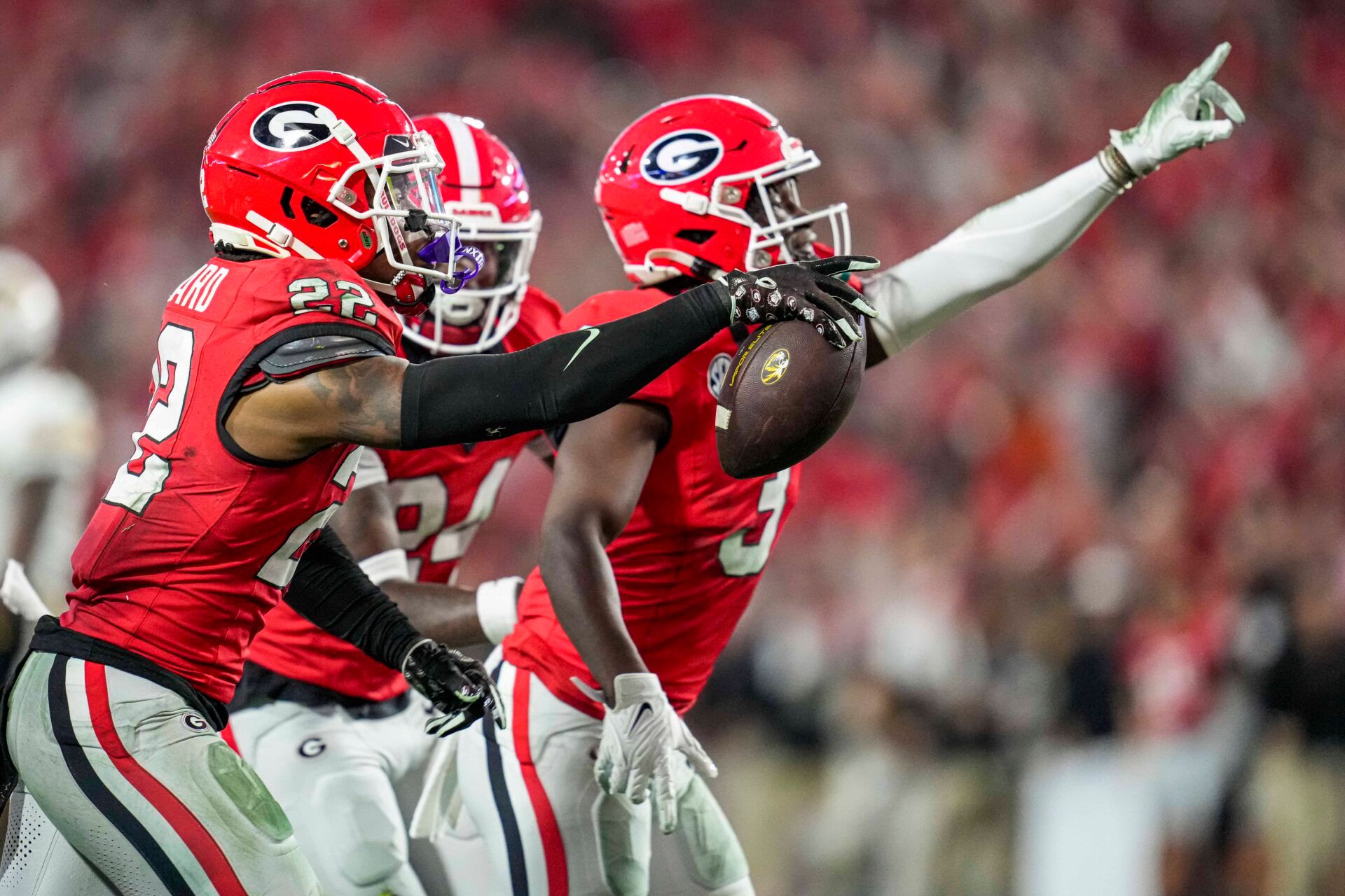 Georgia Bulldogs defensive back Javon Bullard (22) reacts with defensive back Kamari Lassiter (3) after intercepting a pass against the Missouri Tigers during the second half at Sanford Stadium.