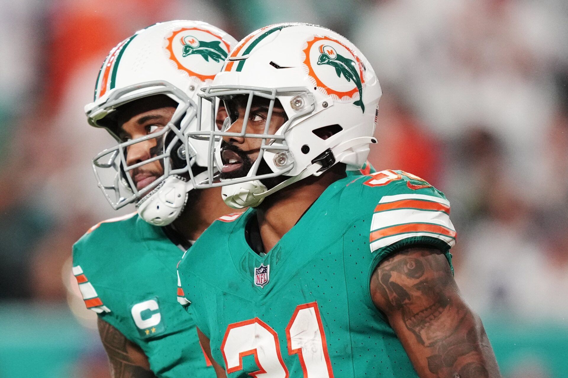 Miami Dolphins quarterback Tua Tagovailoa (1) congratulates running back Raheem Mostert (31) after scoring a touchdown against the Dallas Cowboys during the first half of an NFL game