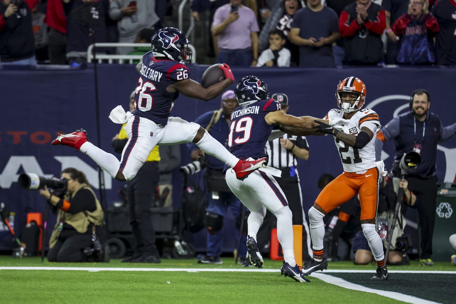 Houston Texans running back Devin Singletary (26) lunges for a touch down during the third quarter in a 2024 AFC wild card game at NRG Stadium.