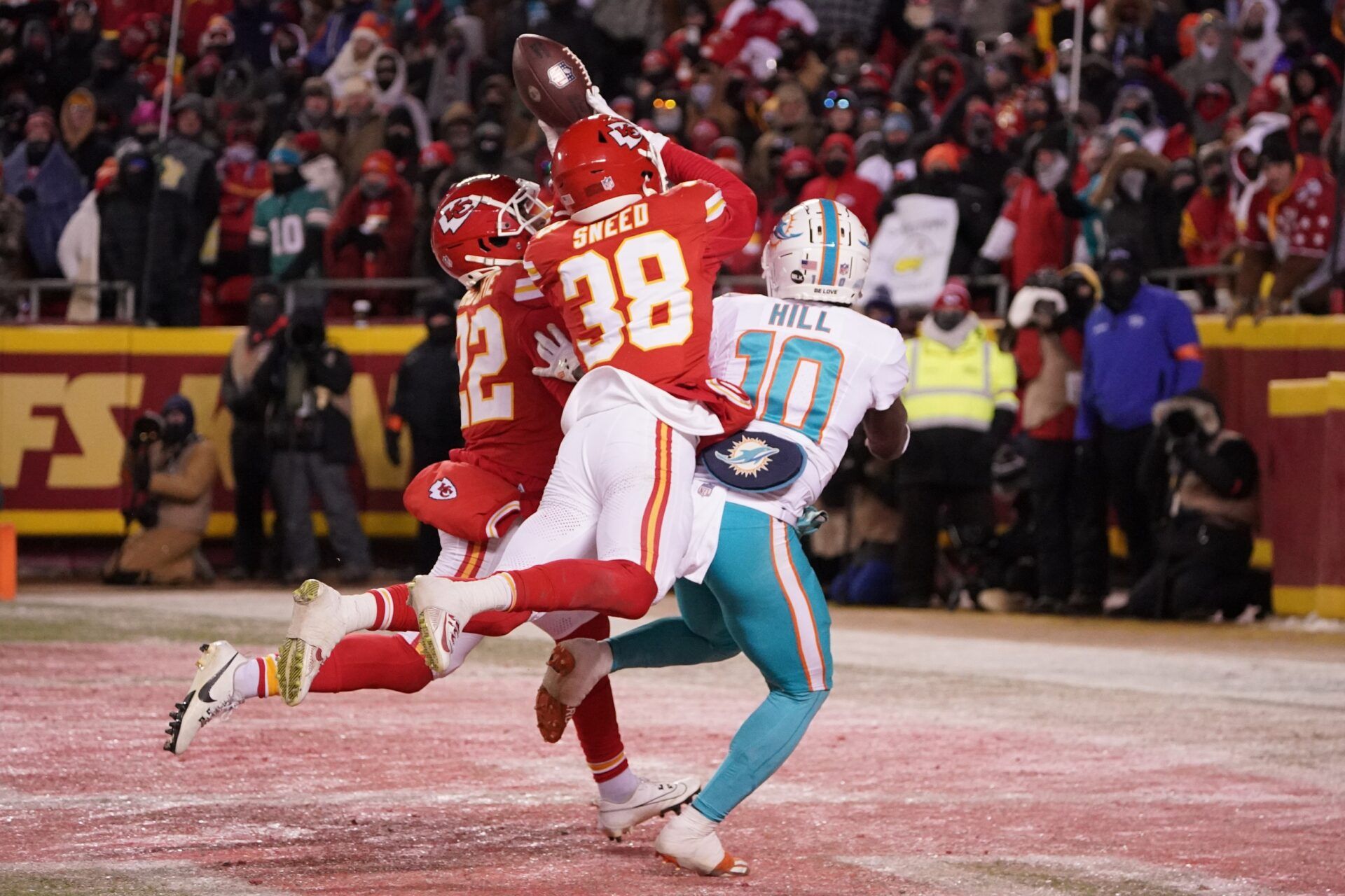 Kansas City Chiefs cornerback L'Jarius Sneed (38) and cornerback Trent McDuffie (22) break up a pass intended for Miami Dolphins wide receiver Tyreek Hill (10) during the second half of the 2024 AFC wild card game at GEHA Field at Arrowhead Stadium.