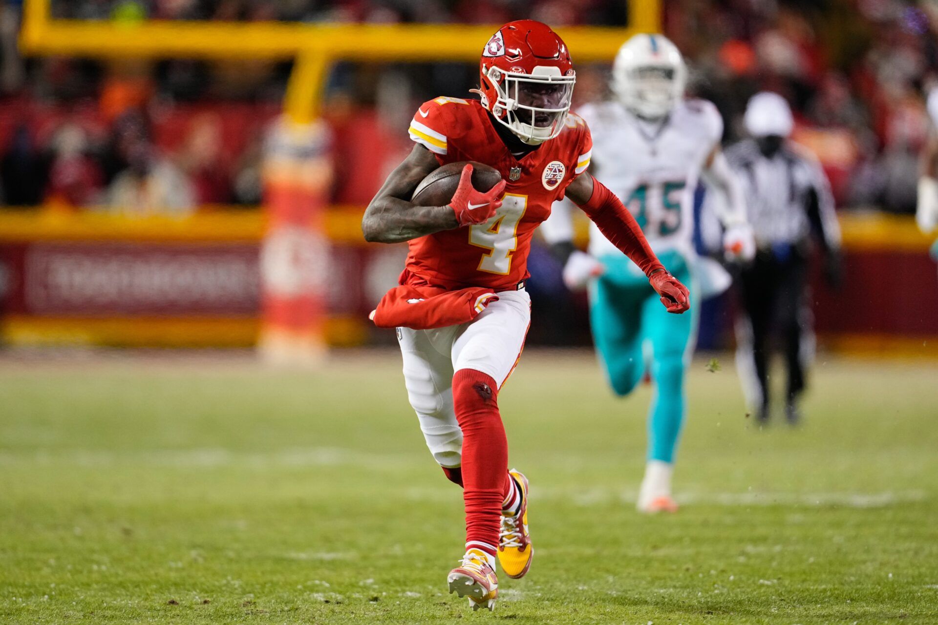 Kansas City Chiefs wide receiver Rashee Rice (4) runs the ball against the Miami Dolphins during the second half of the 2024 AFC wild card game at GEHA Field at Arrowhead Stadium.