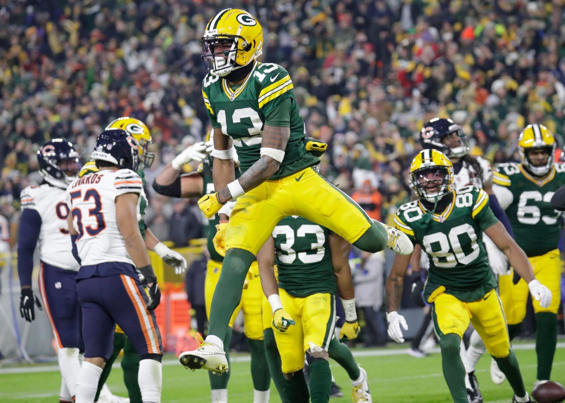 Green Bay Packers wide receiver Dontayvion Wicks (13) celebrates scoring a third quarter touchdown against the Chicago Bears during their football game Sunday, January 7, 2024, in Green Bay, Wisconsin.