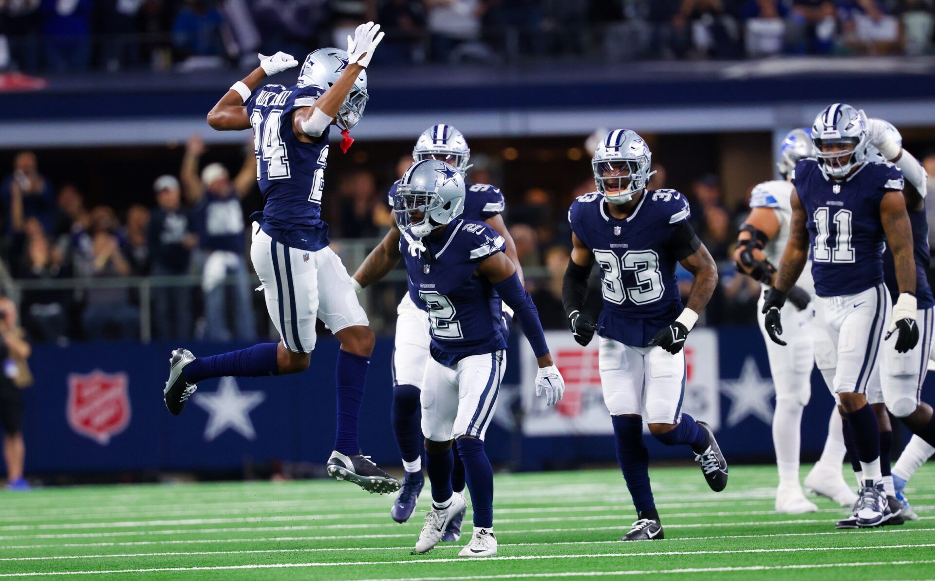 Dallas Cowboys CB Jourdan Lewis (2) celebrates with teammates after making an interception against the Detroit Lions.