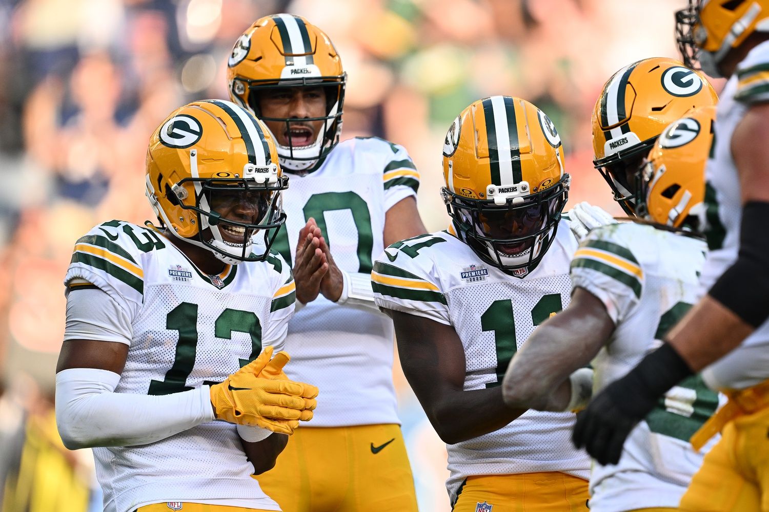 Green Bay Packers players celebrate after a touchdown against the Chicago Bears.