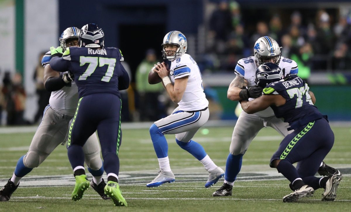 As a member of the Detroit Lions, QB Matthew Stafford (9) looks to throw against the Seattle Seahawks.