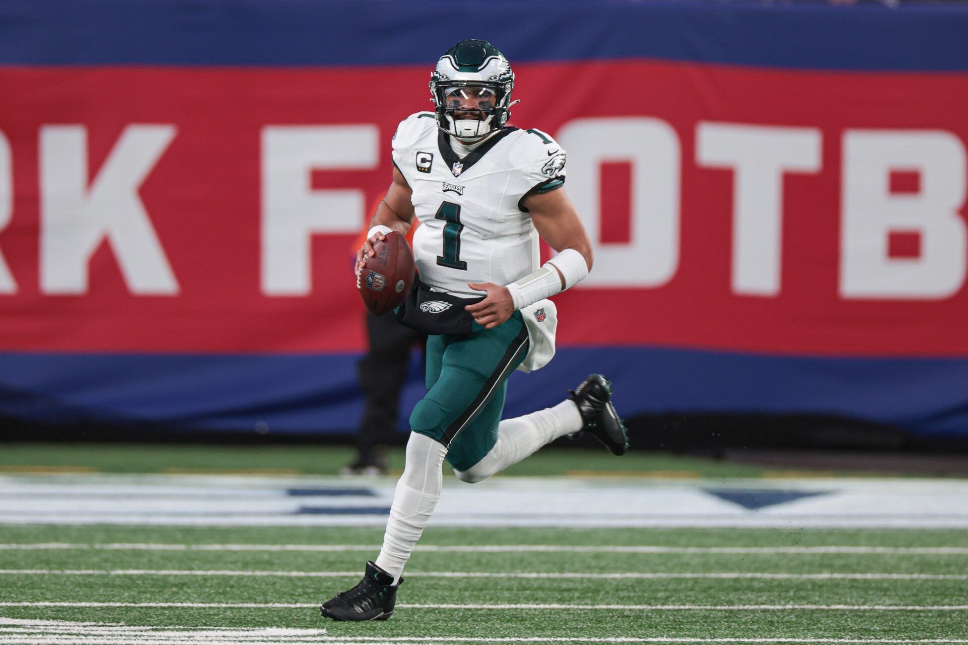 Philadelphia Eagles quarterback Jalen Hurts (1) scrambles against the New York Giants during the first quarter at MetLife Stadium.