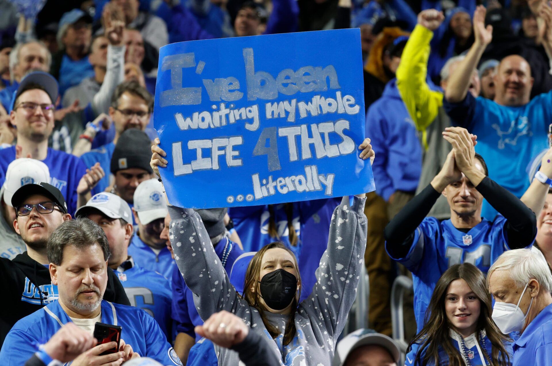 Detroit Lions fans celebrate after the Lions beat the L.A. Rams, 24-23, in the wild-card round of the NFL playoffs at Ford Field in Detroit on Sunday, Jan. 14, 2024.