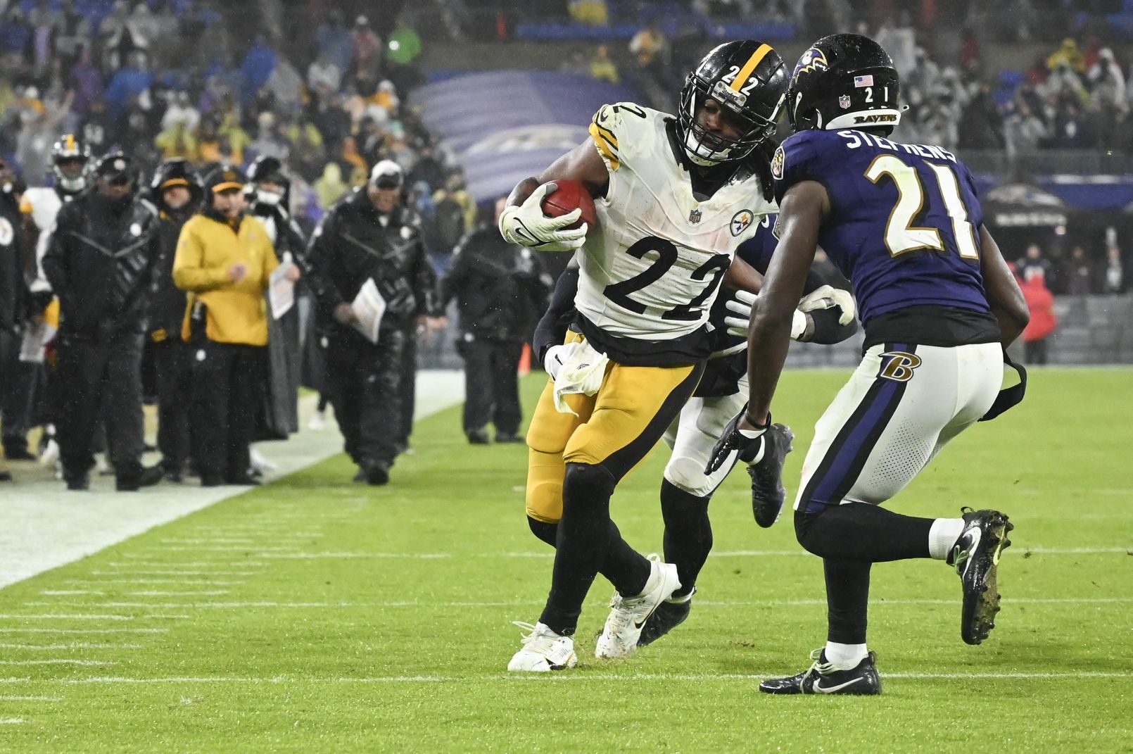 Pittsburgh Steelers running back Najee Harris (22) rushes as Baltimore Ravens cornerback Brandon Stephens (21) defends during the second half at M&T Bank Stadium.