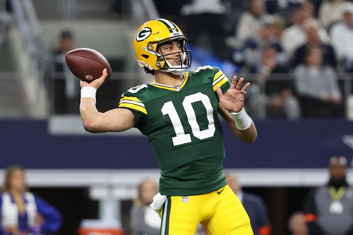 Green Bay Packers quarterback Jordan Love (10) drops back to pass against the Dallas Cowboys in the first half of the 2024 NFC wild card game at AT&T Stadium.