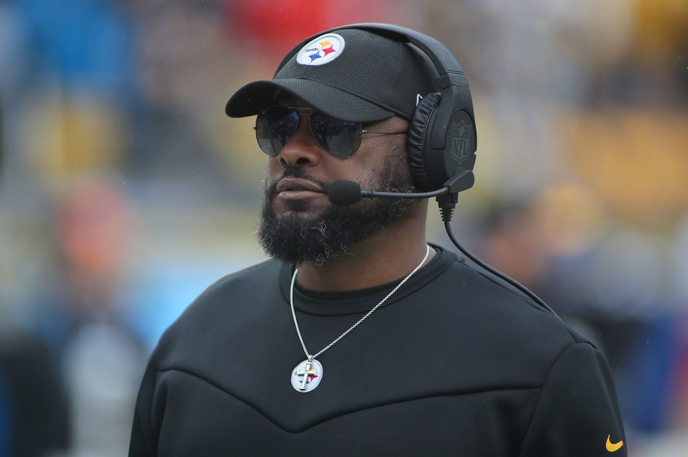 Pittsburgh Steelers head coach Mike Tomlin roams the sidelines during player introductions prior to the start of the game against the Jacksonville Jaguars.