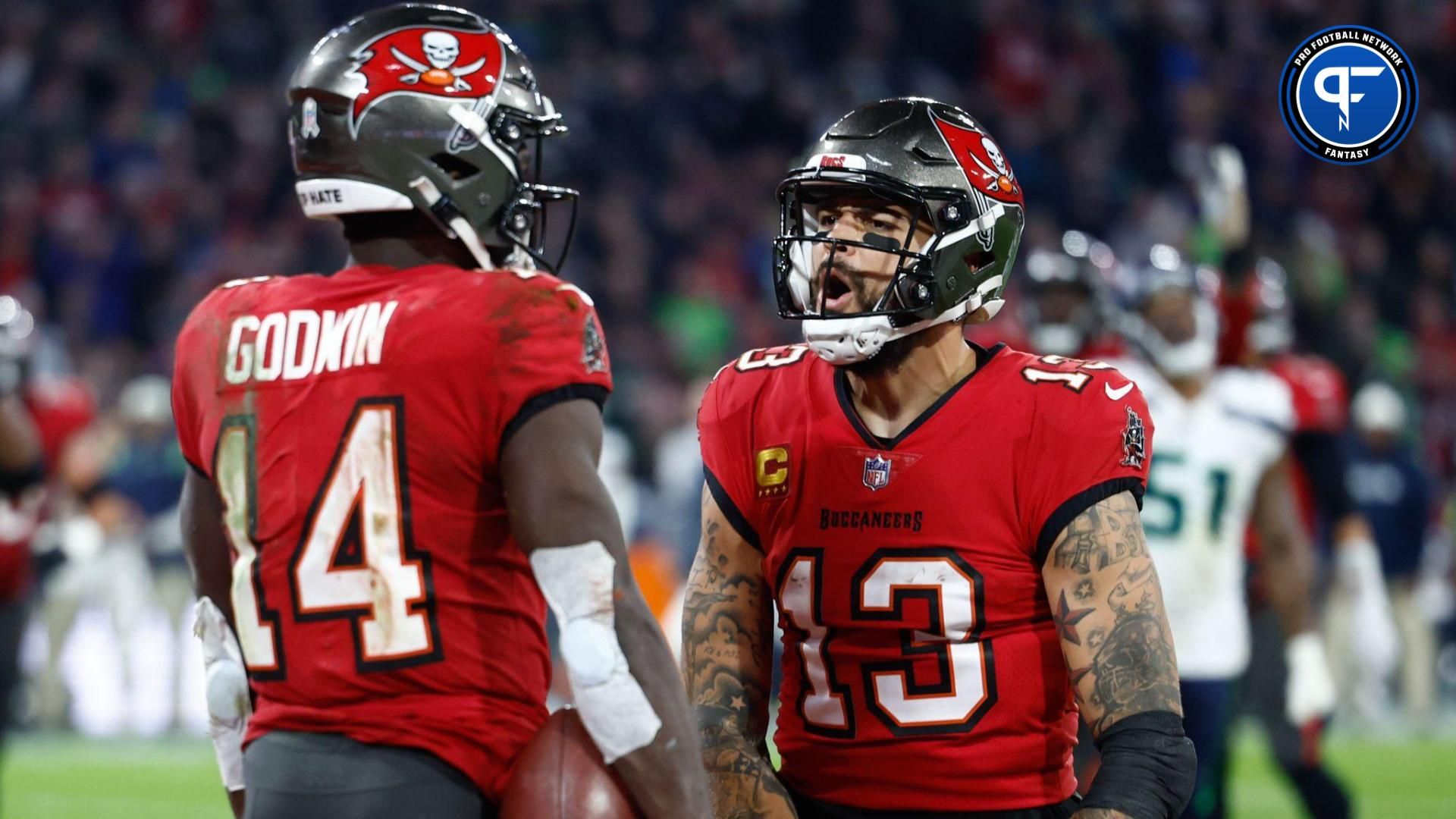 Tampa Bay Buccaneers wide receiver Chris Godwin (14) celebrates his touchdown with teammate wide receiver Mike Evans (13) against the Seattle Seahawks during the fourth quarter of an International Series game at Allianz Arena.