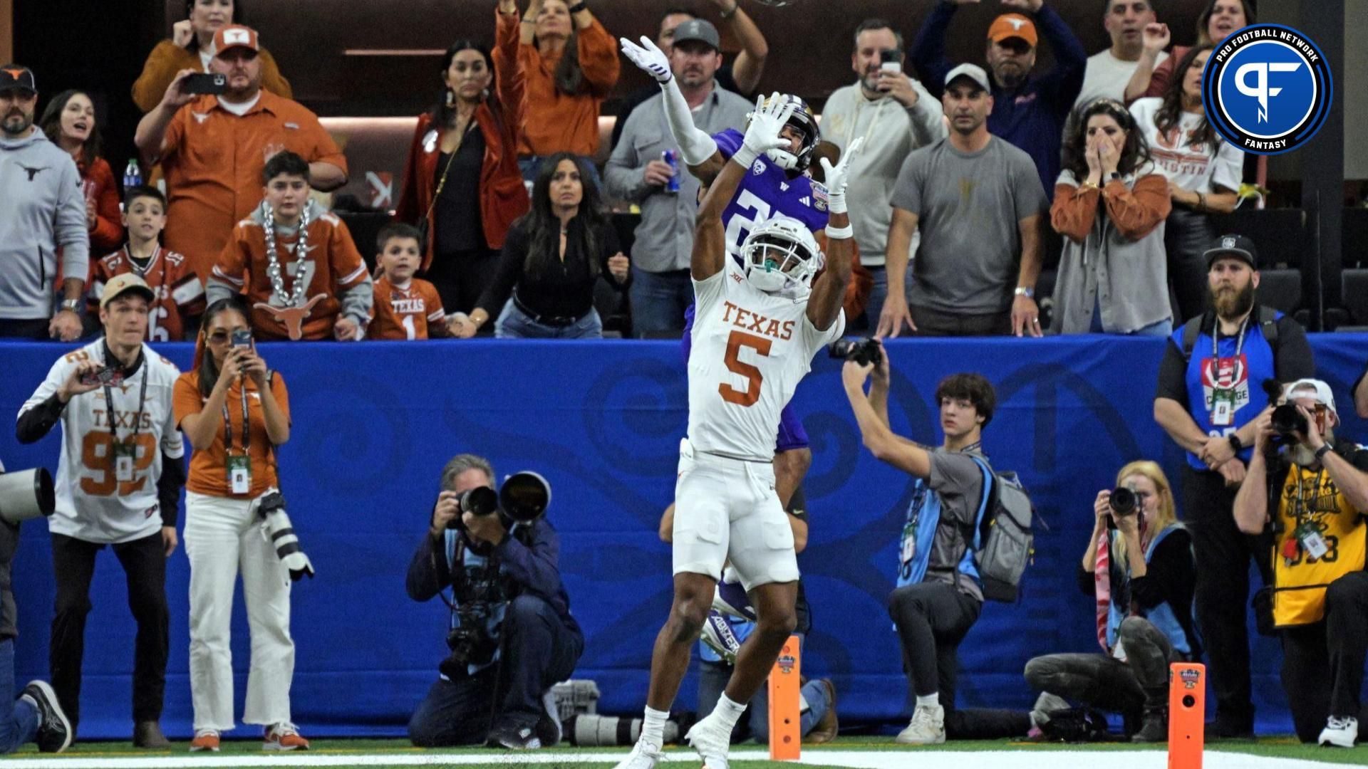 Washington Huskies cornerback Elijah Jackson (25) knocks the ball away from Texas Longhorns wide receiver Adonai Mitchell (5) during the fourth quarter in the 2024 Sugar Bowl college football playoff semifinal game at Caesars Superdome.