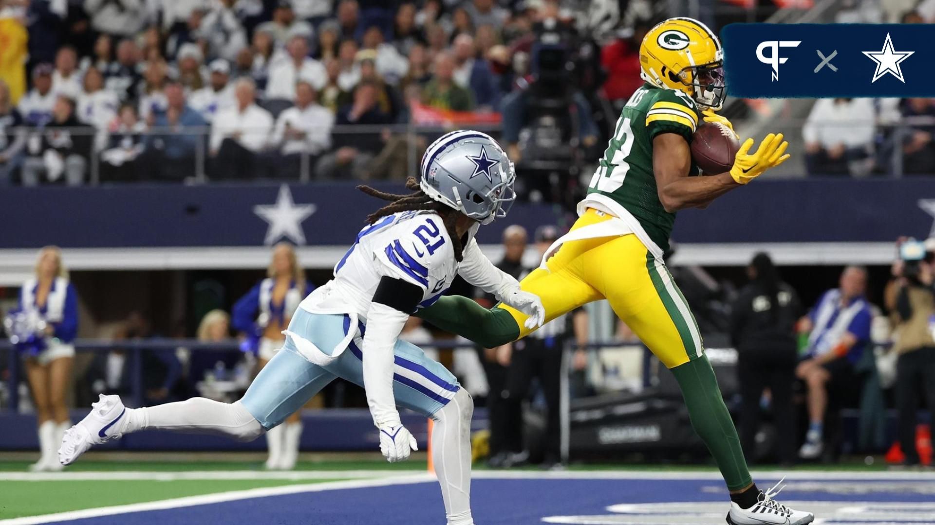 een Bay Packers wide receiver Dontayvion Wicks (13) makes a touchdown catch against Dallas Cowboys cornerback Stephon Gilmore (21) in the first half of the 2024 NFC wild card game at AT&T Stadium.