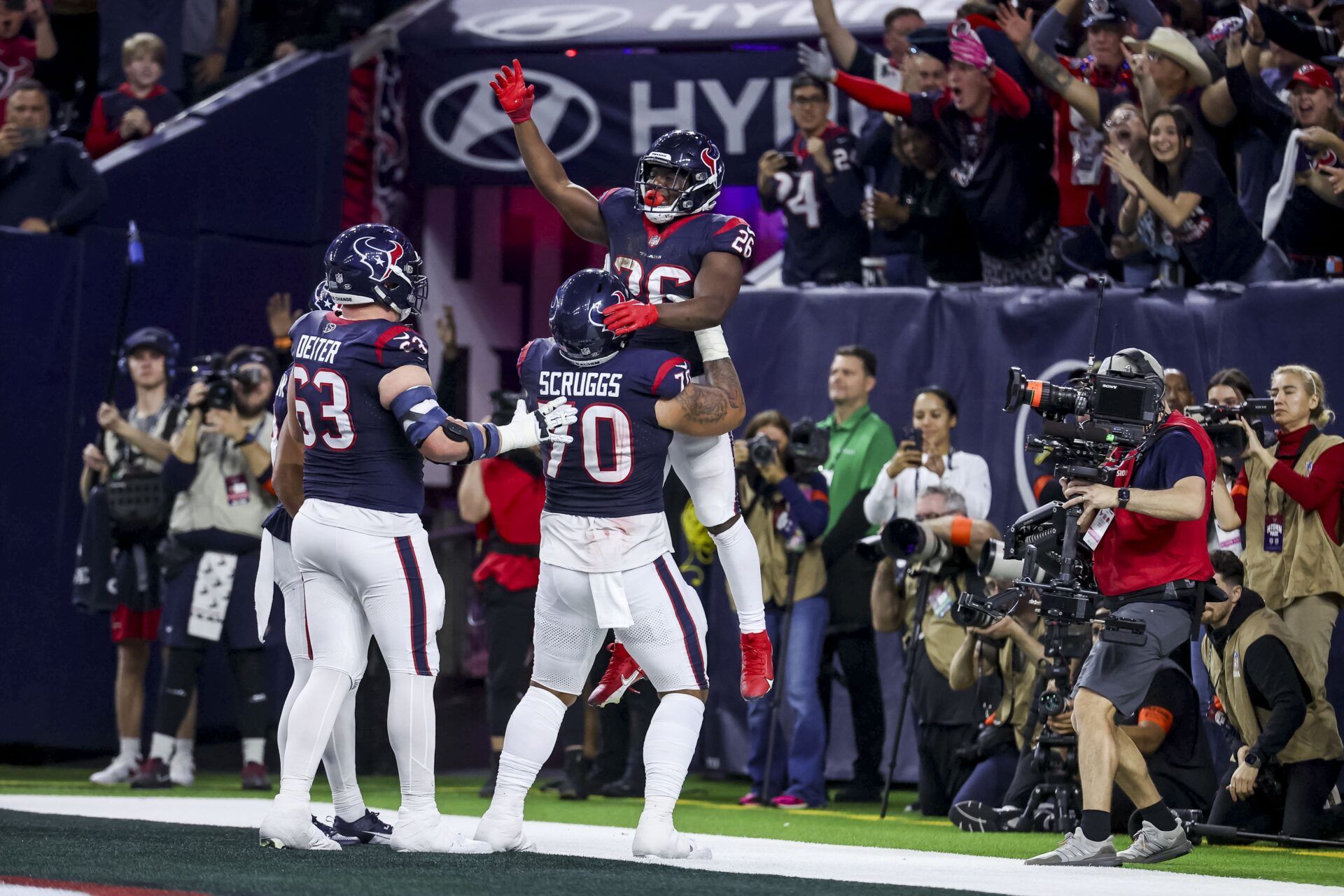 Houston Texans running back Devin Singletary (26) celebrates scoring a touchdown during the fourth quarter in a 2024 AFC wild card game at NRG Stadium.