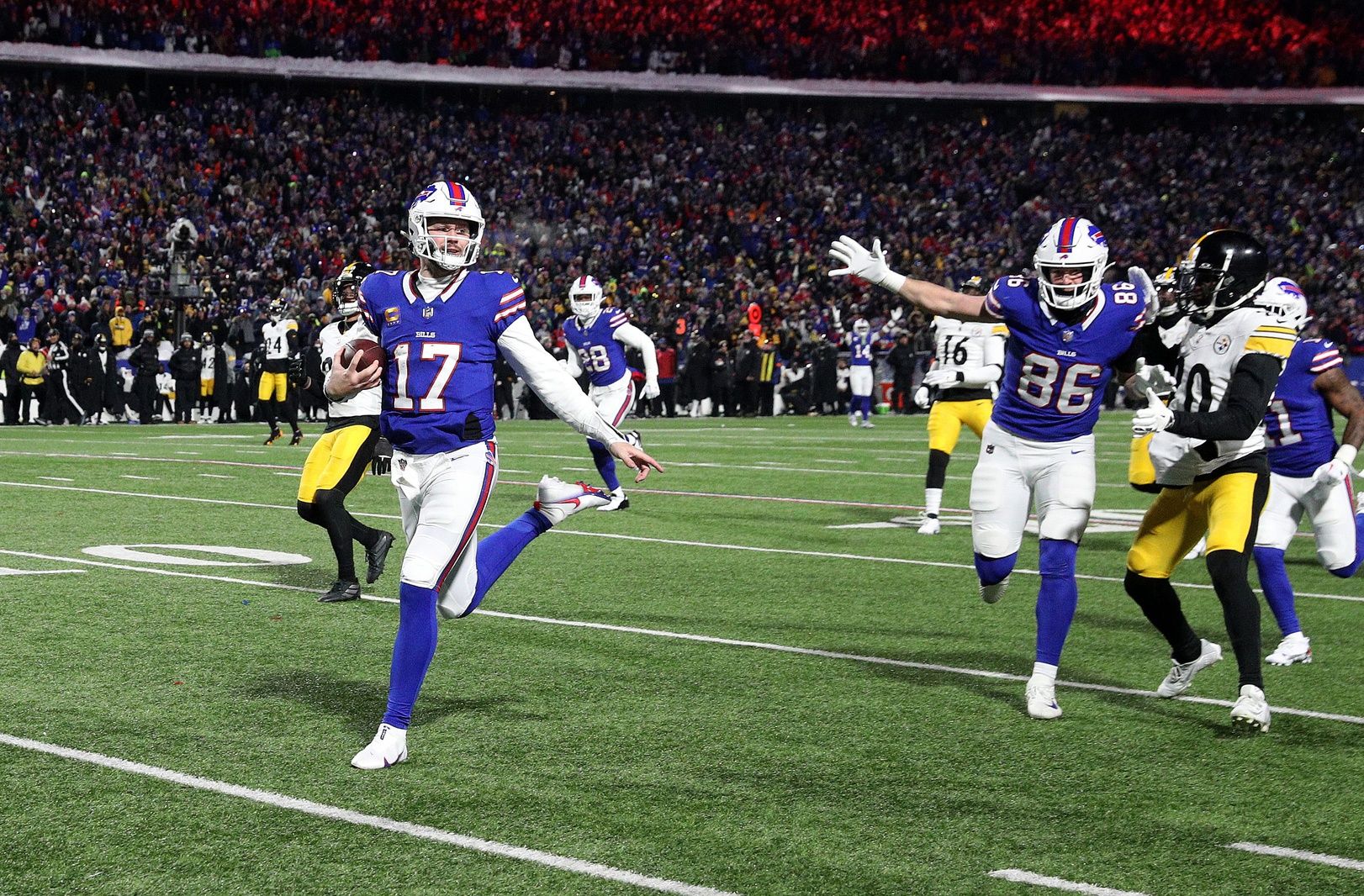 Buffalo Bills quarterback Josh Allen (17) runs into the end zone on this 52 yard run.