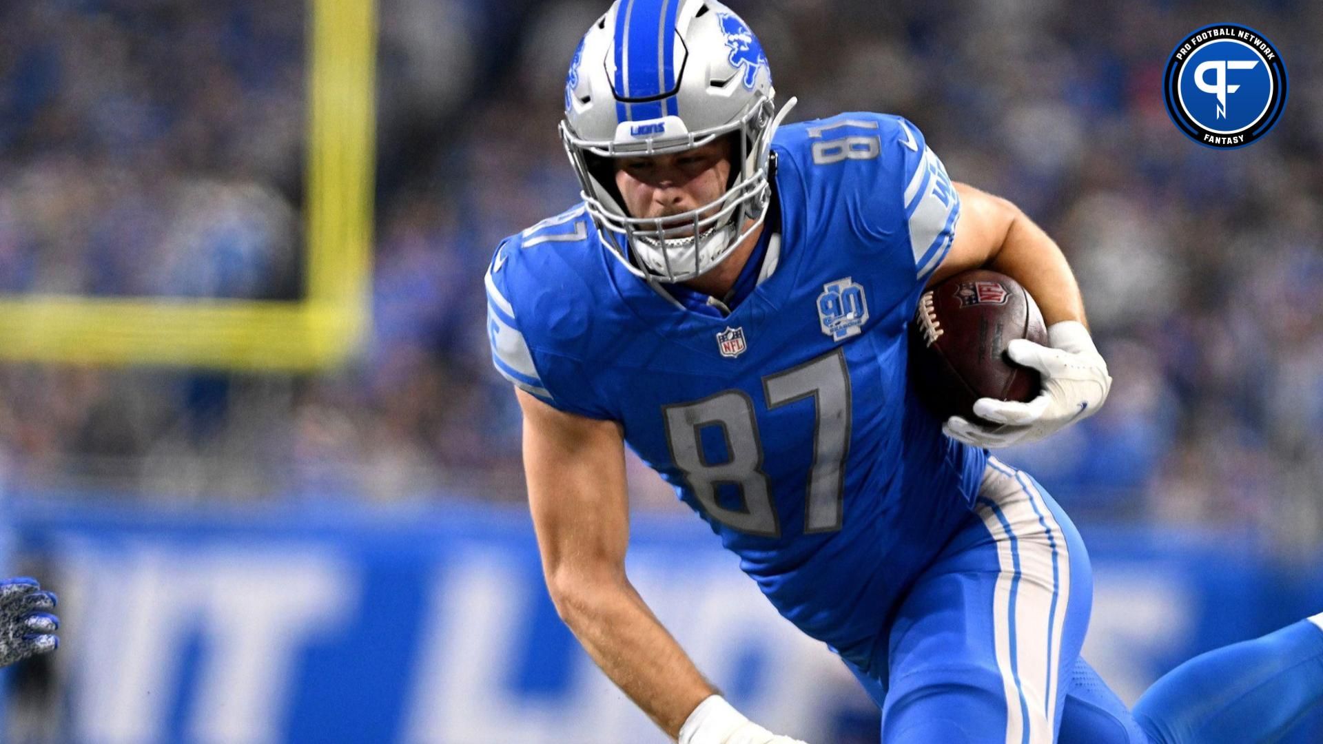 Detroit Lions tight end Sam LaPorta (87) runs after a catch during the first half of a 2024 NFC wild card game against the Los Angeles Rams at Ford Field.