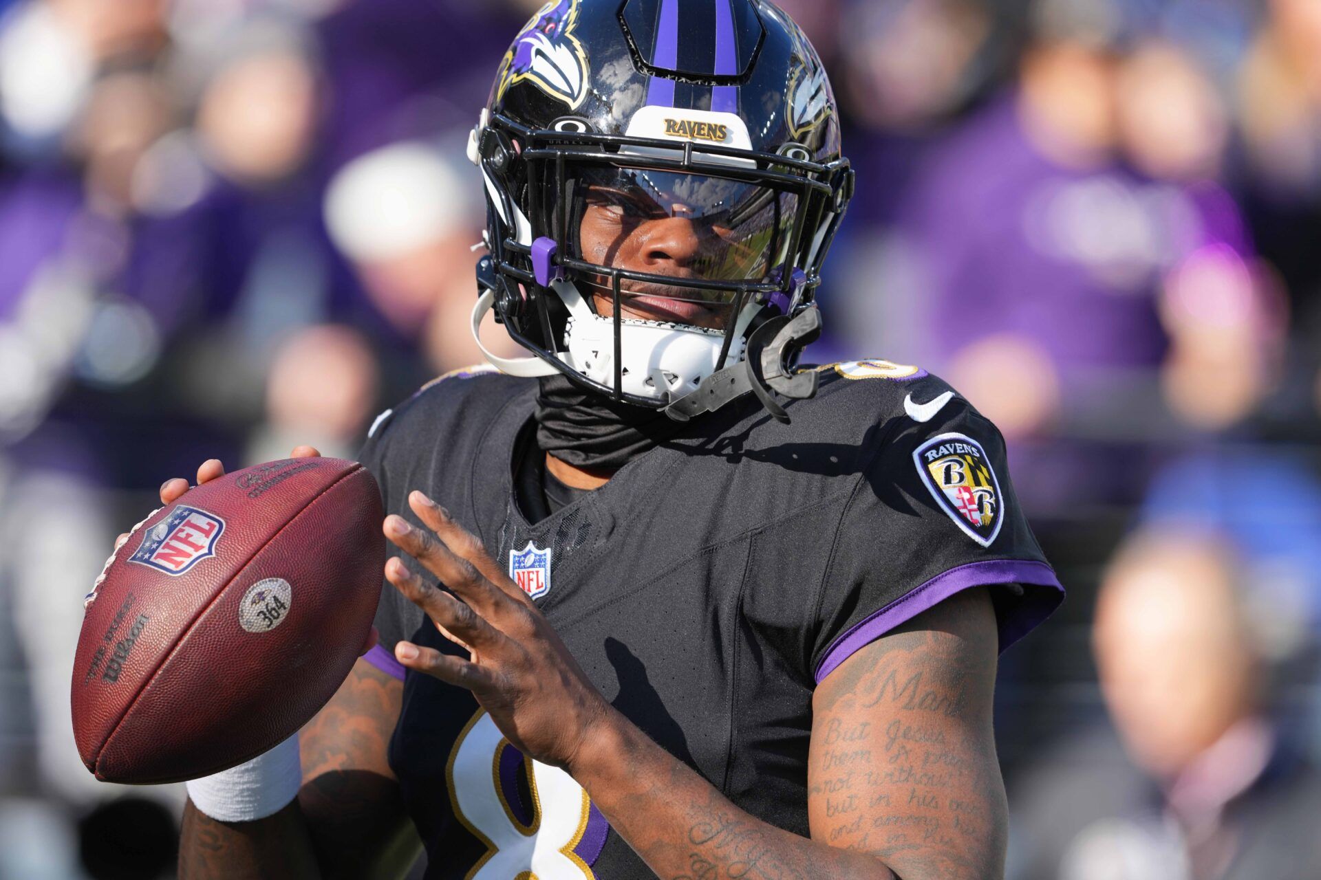 Baltimore Ravens quarterback Lamar Jackson (8) warms up prior to the game against the Miami Dolphins at M&T Bank Stadium.